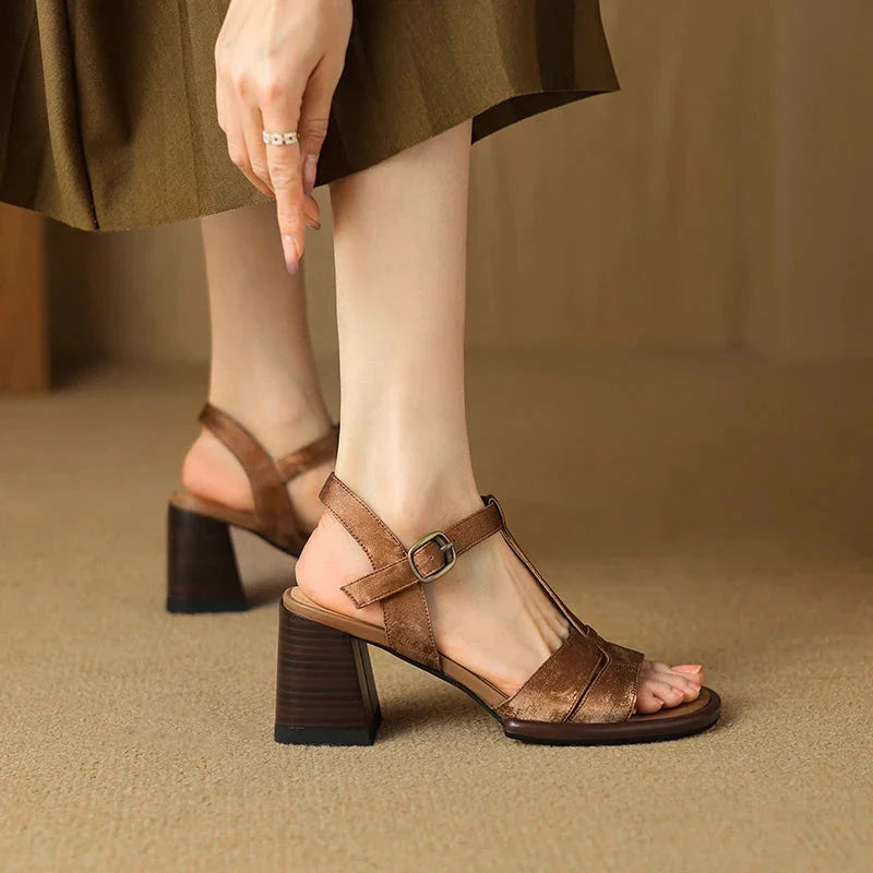 Genuine leather gladiator sandals with chunky heel, open-toe design, and secure buckle closure for summer style and comfort.