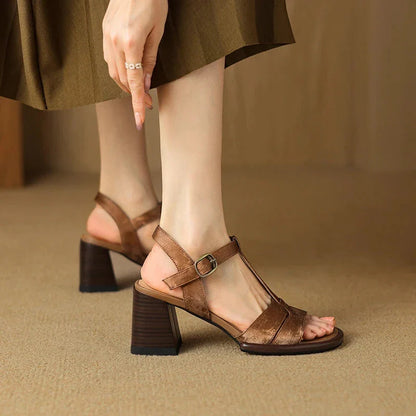 Genuine leather gladiator sandals with chunky heel, open-toe design, and secure buckle closure for summer style and comfort.