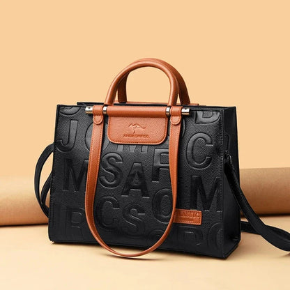 Sophisticated large leather tote bag with embossed lettering design, suitable for daily use and travel