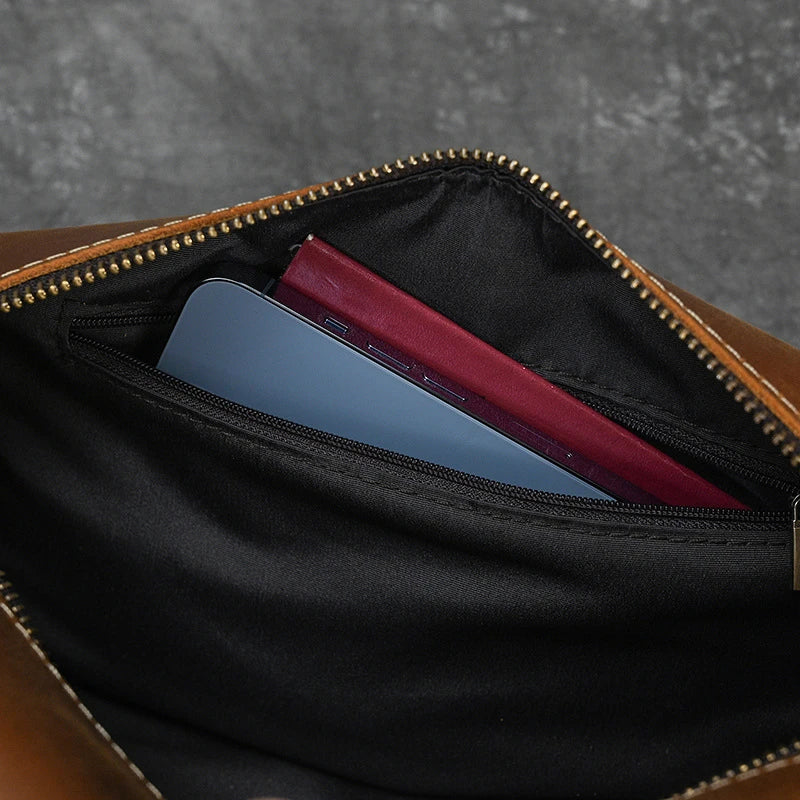 Premium leather clutch bag with multiple interior pockets, designed for the sophisticated British gentleman