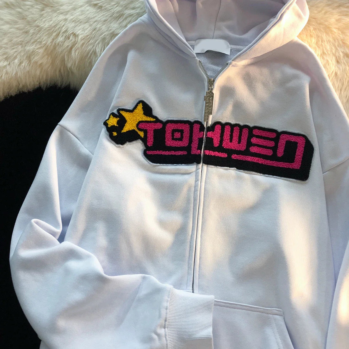 Women's oversized hooded sweater in white with letter embroidery design, a cozy and stylish casual fashion accessory