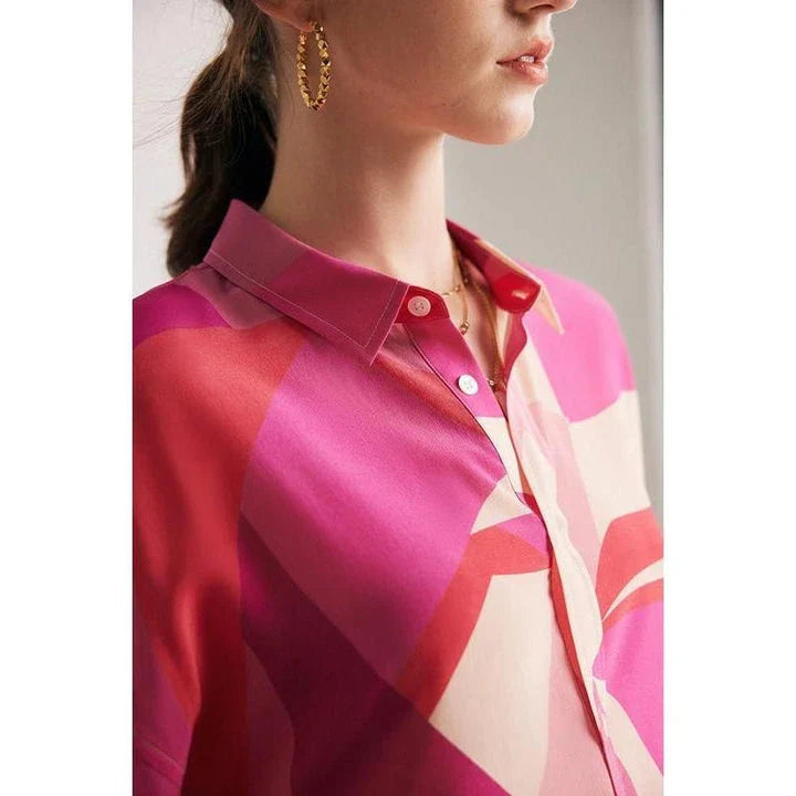 Elegant silk crepe de chine blouse in a unique print design, featuring a loose, straight fit and classic collar for a sophisticated yet comfortable look.