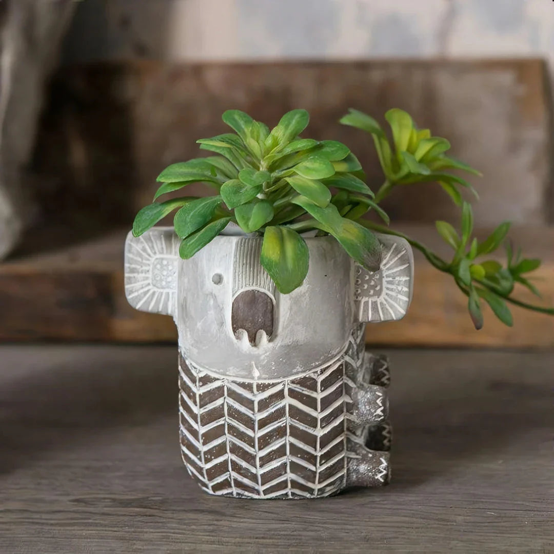 Charming retro koala-shaped cement planter for succulents and small flowers, available in two sizes