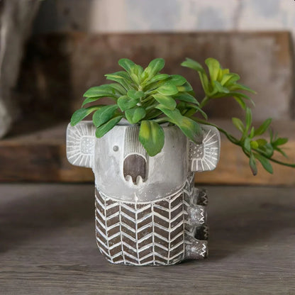 Charming retro koala-shaped cement planter for succulents and small flowers, available in two sizes