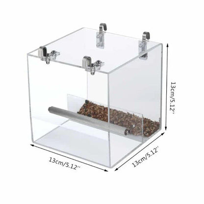 A transparent acrylic bird feeder cube with a sleek and modern design, perfect for adding a touch of elegance to your garden or balcony.