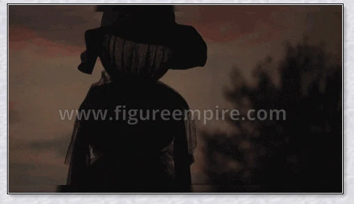 Three tall, black-robed witch figures with faceless glowing heads, standing together and holding hands, creating a spooky outdoor Halloween display