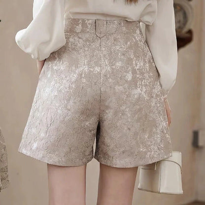 Elegant high-waisted floral jacquard A-line shorts with chic metal buttons, perfect for any occasion