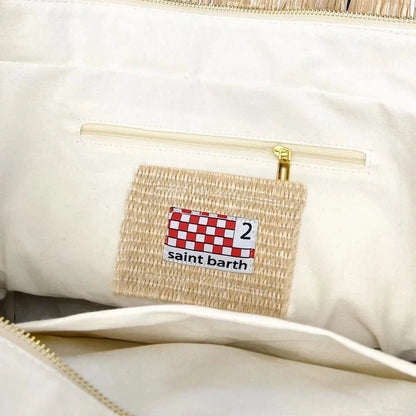 Stylish embroidered straw tote bag with playful tassels, perfect for summer outings and beach adventures.