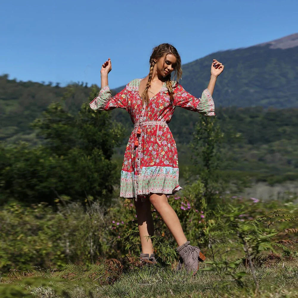 Elegant Bohemian-inspired pleated print dress in a vibrant pink colour, perfect for a day at the British seaside resort.