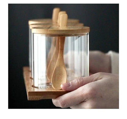 Premium glass and wood storage jars set with serving spoon, featuring airtight lids and minimalist design