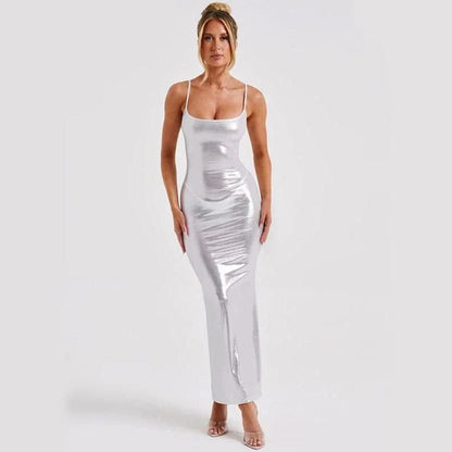 Elegant backless maxi dress with spaghetti straps in white, a sophisticated British fashion piece for special occasions.
