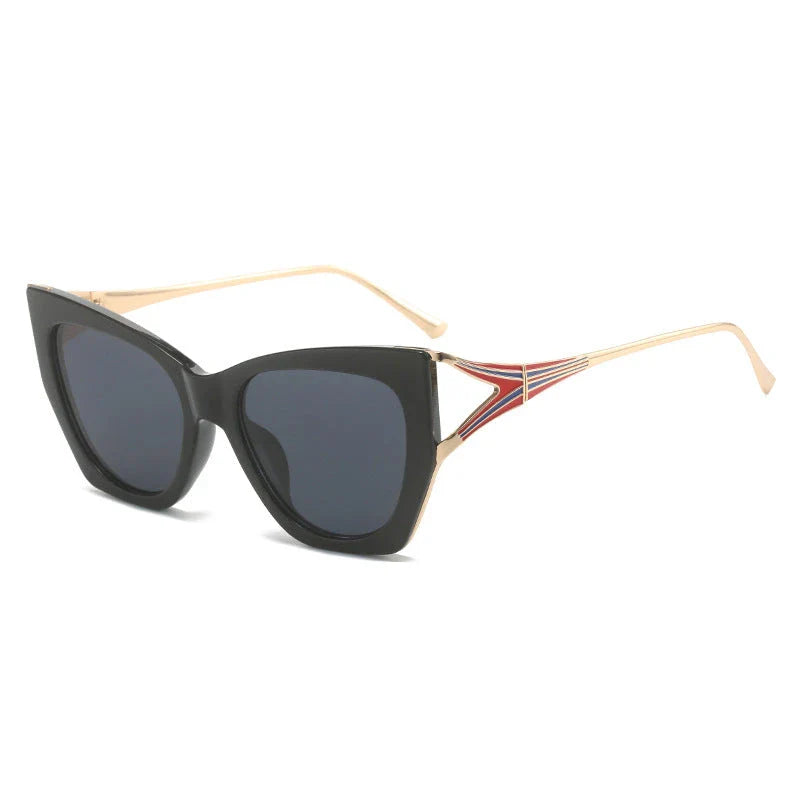 Refined cat eye sunglasses with blue gradient lenses and sleek metal frames, offering timeless British style and UV400 protection.