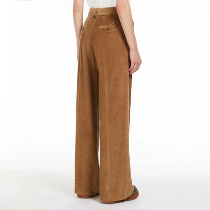 A pair of high-waist, wide-leg corduroy trousers in a classic red colour, designed for the modern British woman's wardrobe.