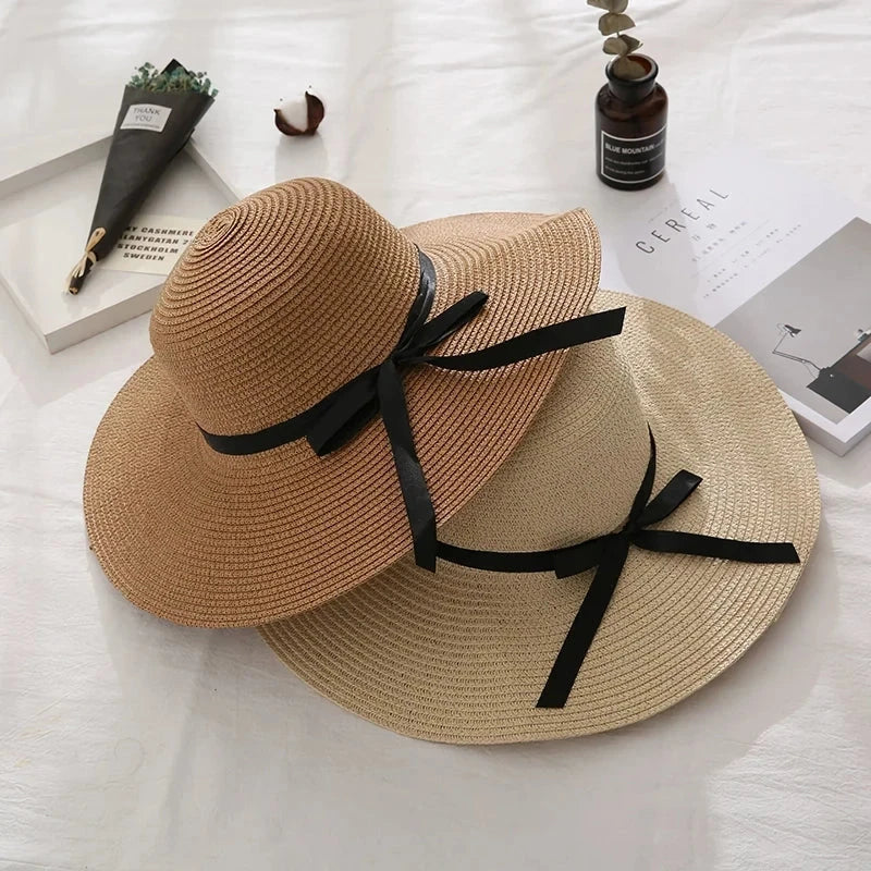 Fashionable straw hat for women with wide brim, foldable design, and stylish bow detail