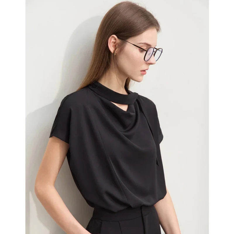 Elegant minimalist women's summer blouse in blue chiffon fabric with tie sleeves and hollow-out decoration
