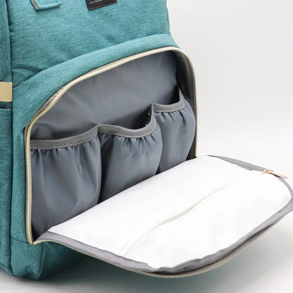 Multifunctional maternity diaper backpack with removable mosquito net, foldable crib, and water-resistant design for convenient family travel