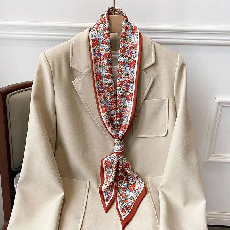 Elegant floral print polyester scarf with a soft, cotton-like texture for versatile seasonal wear