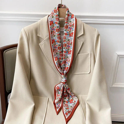 Elegant floral print polyester scarf with a soft, cotton-like texture for versatile seasonal wear