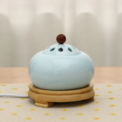 Elegant electric incense burner with adjustable temperature and timer function, perfect for creating a soothing ambiance in your home.