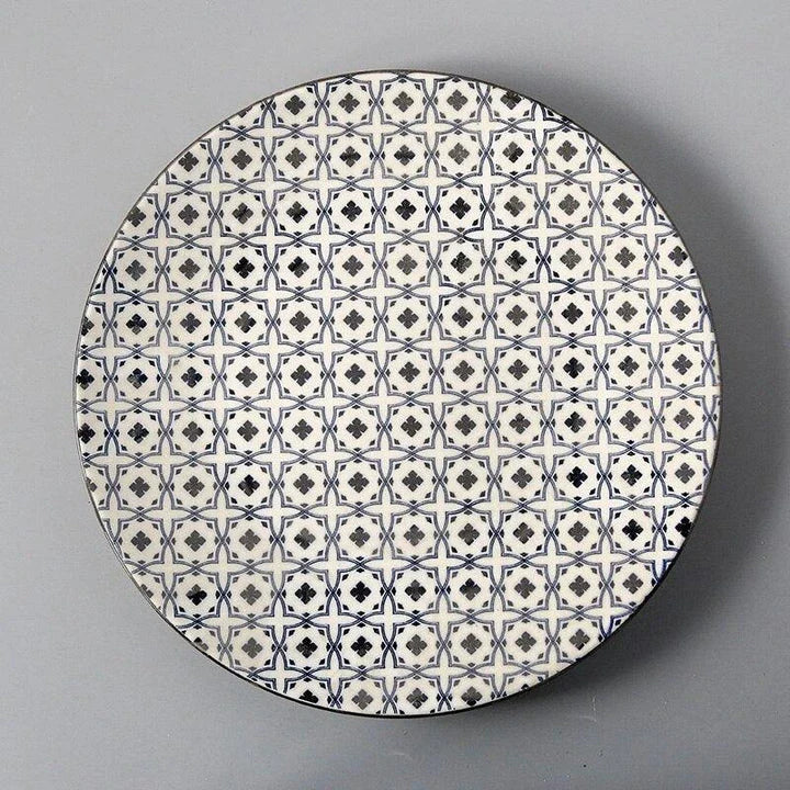 Elegant ceramic plates with vibrant, whimsical prints in a variety of enchanting designs