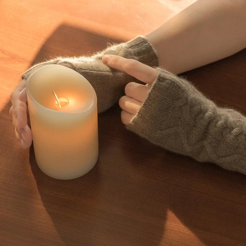 Luxurious cashmere gloves in beige and camel colours, showcasing a unique twist design for a stylish, streamlined silhouette