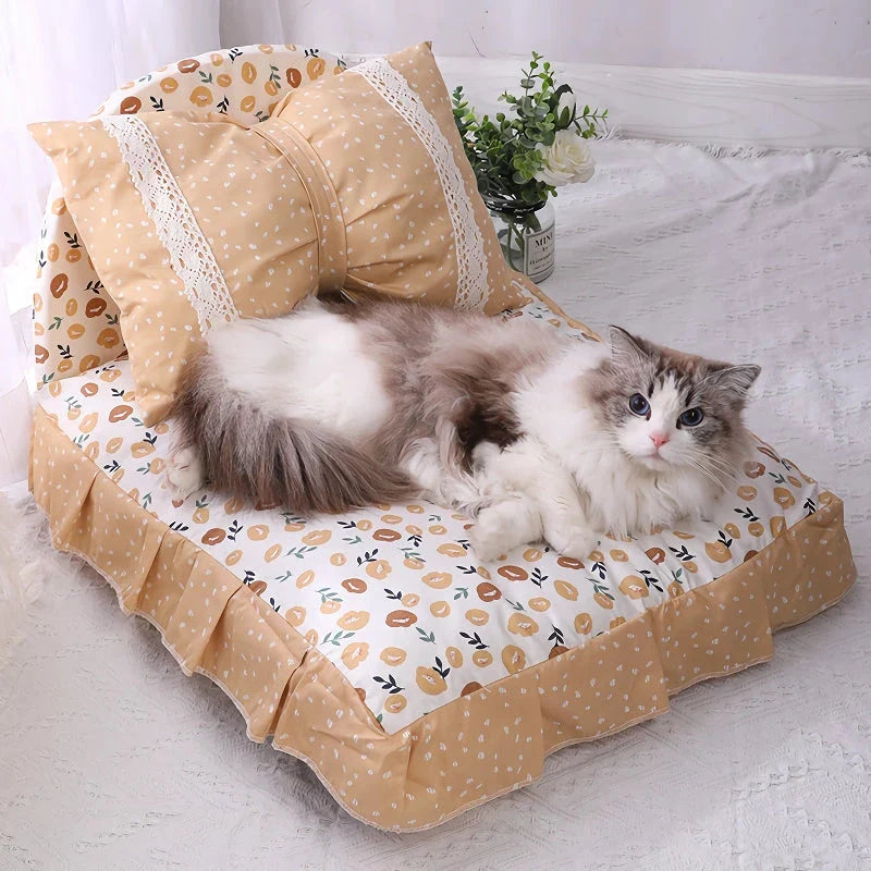 Cosy bow-accented pet bed with a detachable cushion, providing a luxurious and stylish sleeping retreat for small to medium-sized dogs and cats.