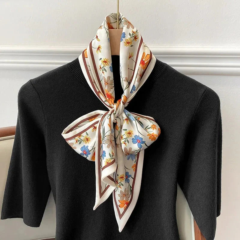 Elegant floral print polyester scarf with a soft, cotton-like texture for versatile seasonal wear