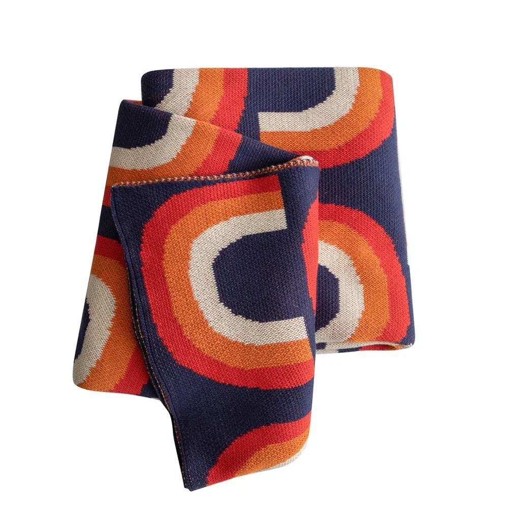 Cosy and vibrant 100% cotton knit throw blanket with a colourful rainbow pattern
