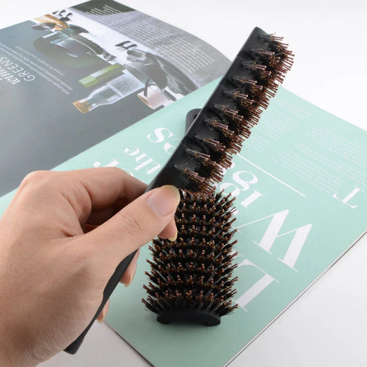 Premium black detangling hair brush with ergonomic long handle for smooth, tangle-free hair and healthy scalp