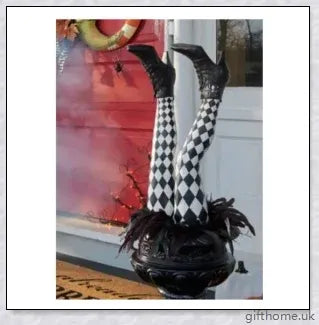 Animated witch legs in various colours, including purple, yellow, and black and white, kicking and moving to create a spooky Halloween display
