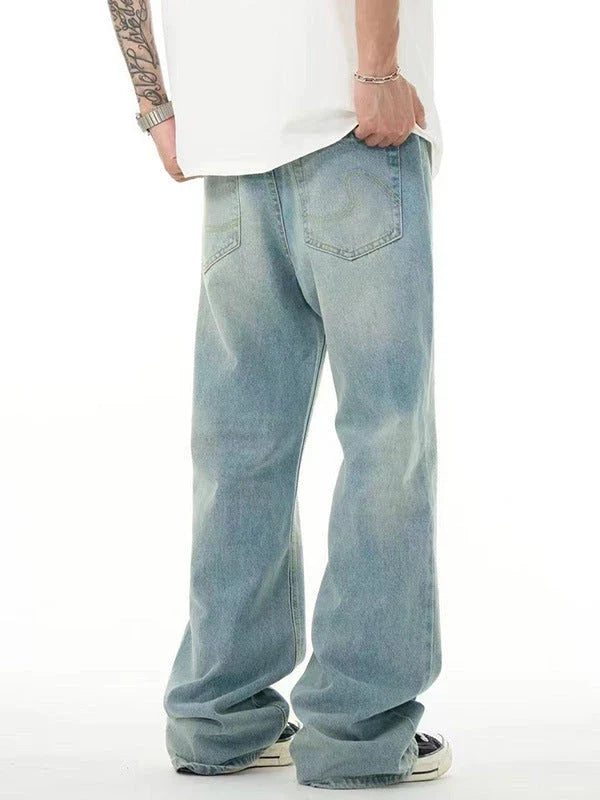 Premium light blue washed relaxed fit jeans with subtle fading and distressing, made from high-quality cotton for exceptional comfort and durability.