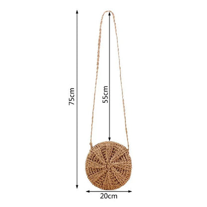 Fashionable rattan round crossbody bag with beige colour and playful tassel accent, perfect for Bohemian-inspired summer style