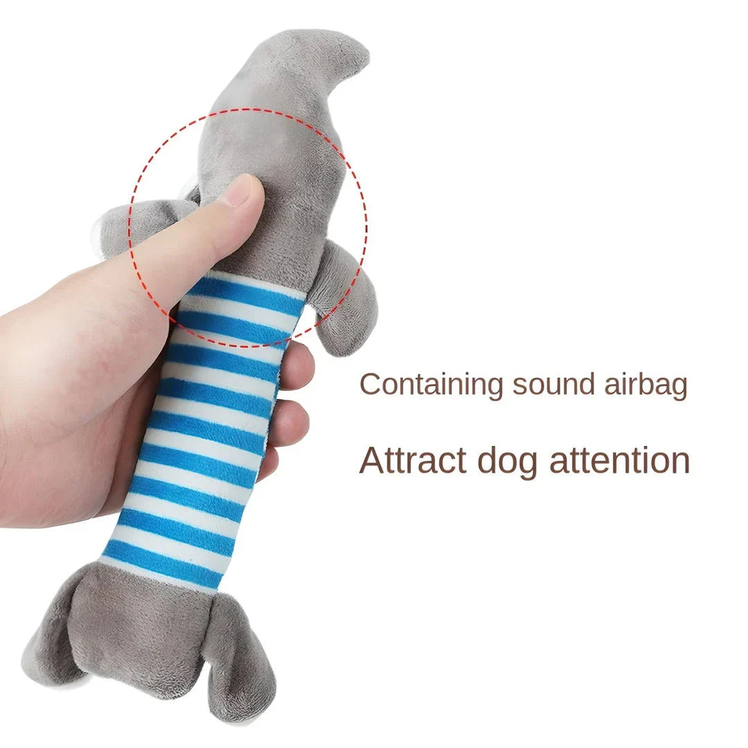 Premium plush squeaky dog toy in various colours, featuring textured stripes for dental cleaning and a built-in sound generator for interactive play.
