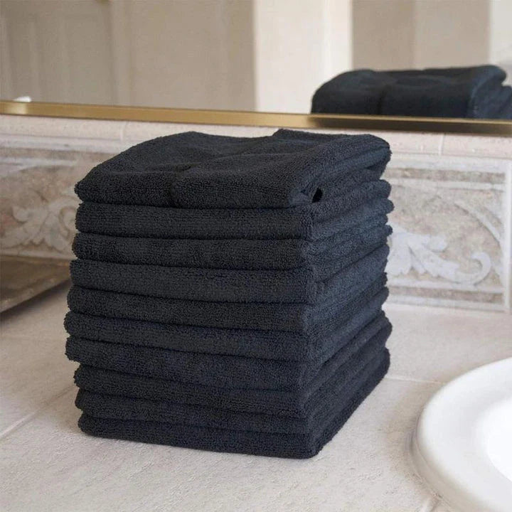 Premium microfibre salon towels in black, featuring a large size, lightweight and highly absorbent design for efficient hair drying