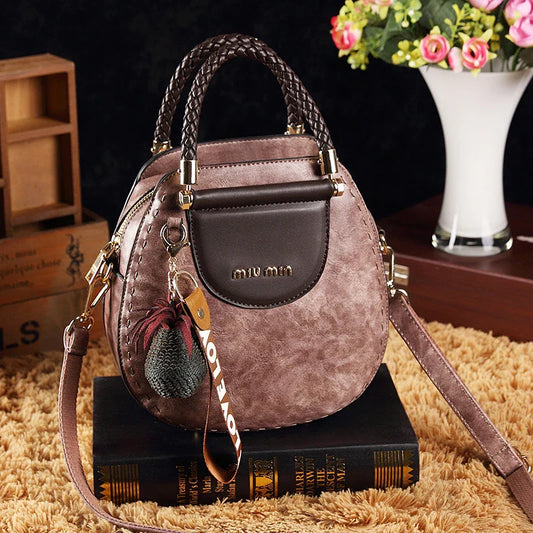 Fashionable women's one-shoulder diagonal bag in caramel, nude pink, black, wine red, and retro brown colours