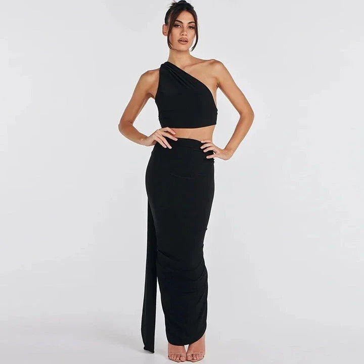 Glamorous backless cocktail dress set with halter-neck crop top and flowing maxi skirt in green colour