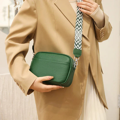 Stylish leather crossbody bag with embroidered strap in various colours