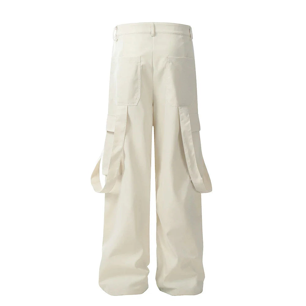 Stylish black pleated overalls with ribbon pockets, a versatile and refined menswear piece.