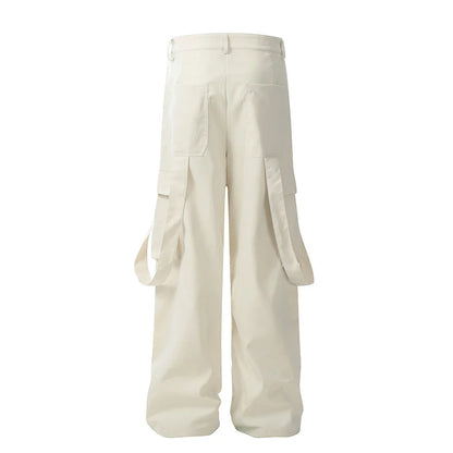 Stylish black pleated overalls with ribbon pockets, a versatile and refined menswear piece.