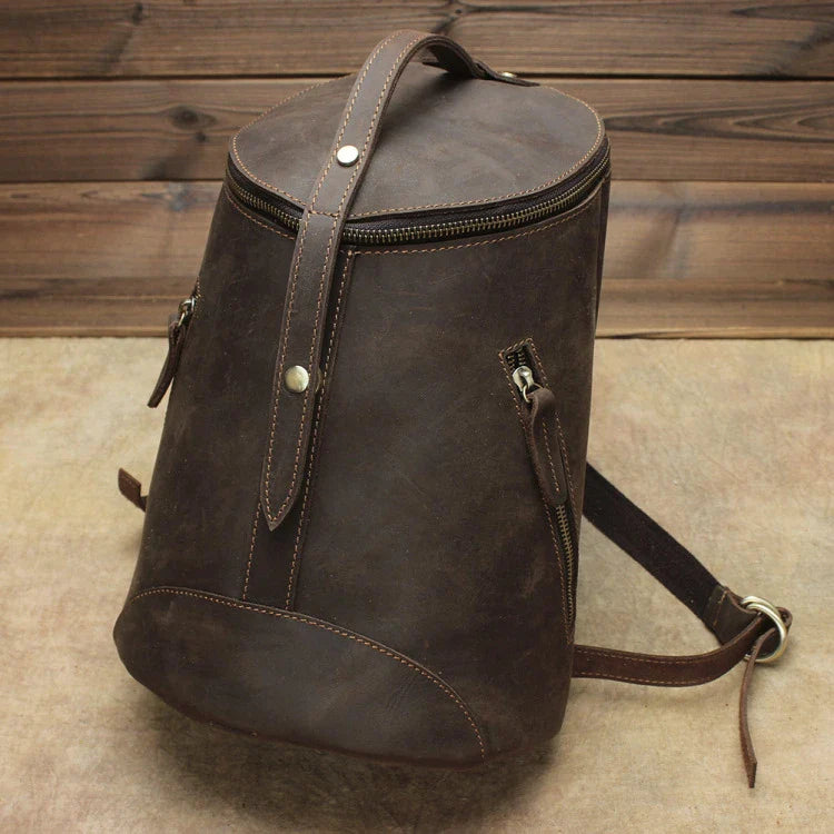 A premium Crazy Horse leather backpack with a classic bucket-style design and retro-inspired flair, perfect for the discerning urban adventurer.