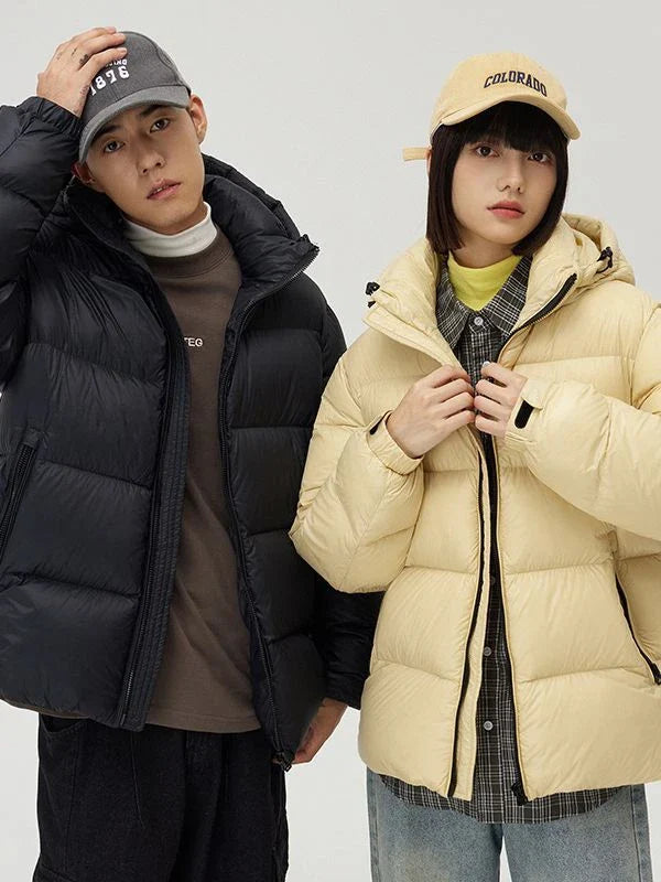 A stylish and warm down jacket with a hooded design, perfect for winter weather.
