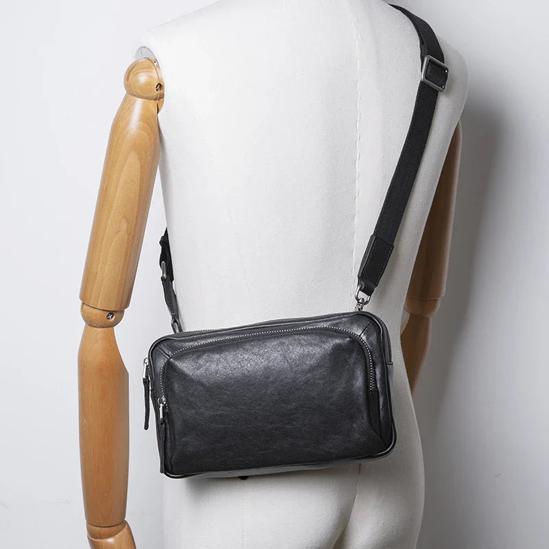 Premium black leather shoulder bag with adjustable strap and multiple compartments for organised storage