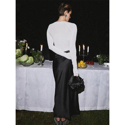 Sophisticated satin maxi skirt with adjustable waist, available in black colour and XS-L sizes