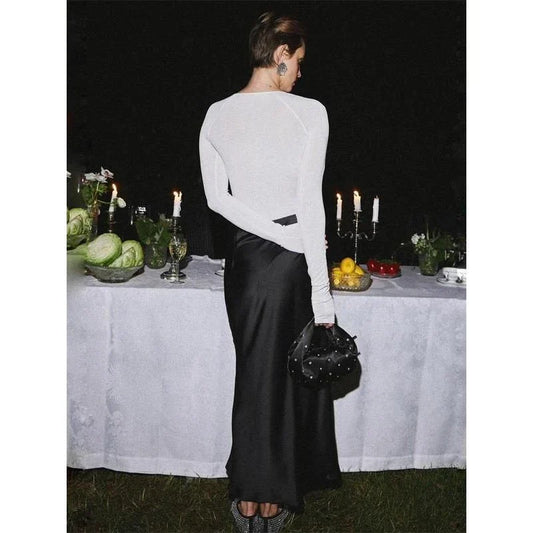 Sophisticated satin maxi skirt with adjustable waist, available in black colour and XS-L sizes