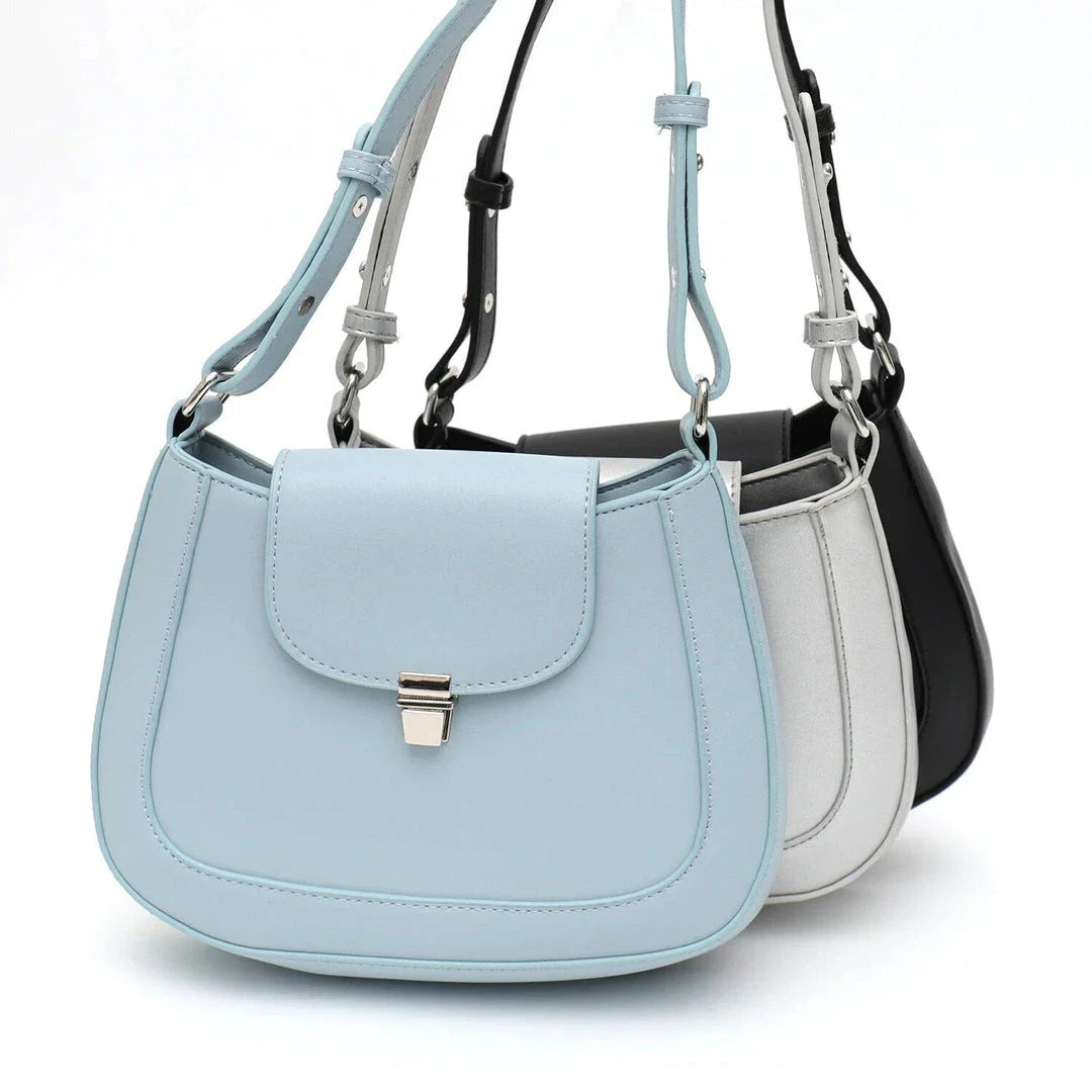 Elegant and versatile vegan leather shoulder bag with adjustable strap, flap cover, and interior pockets for modern British women