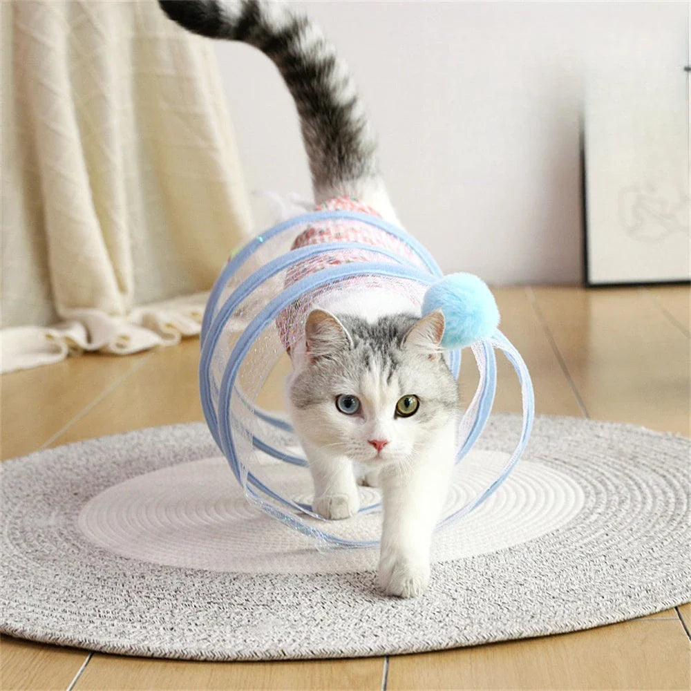 Folding cat play tunnel with various toys like balls, feathers, and mice attached to the sides