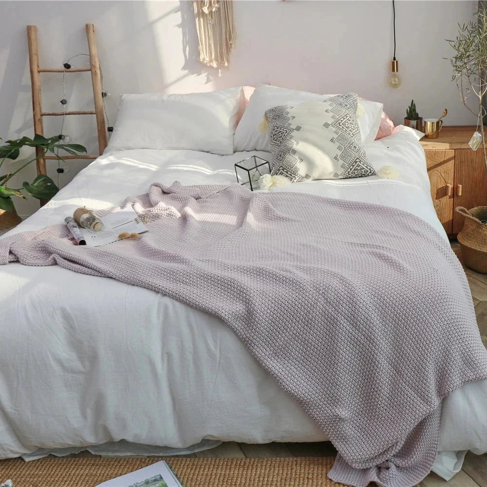 Cosy and sophisticated oversized moss stitch knitted blanket in various colours, perfect for adding warmth and style to any living space