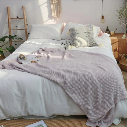 Cosy and sophisticated oversized moss stitch knitted blanket in various colours, perfect for adding warmth and style to any living space