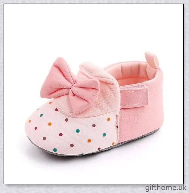 Charming baby toddler shoes with a stylish bowknot design, featuring a breathable cotton upper and non-slip sole for comfort and security.
