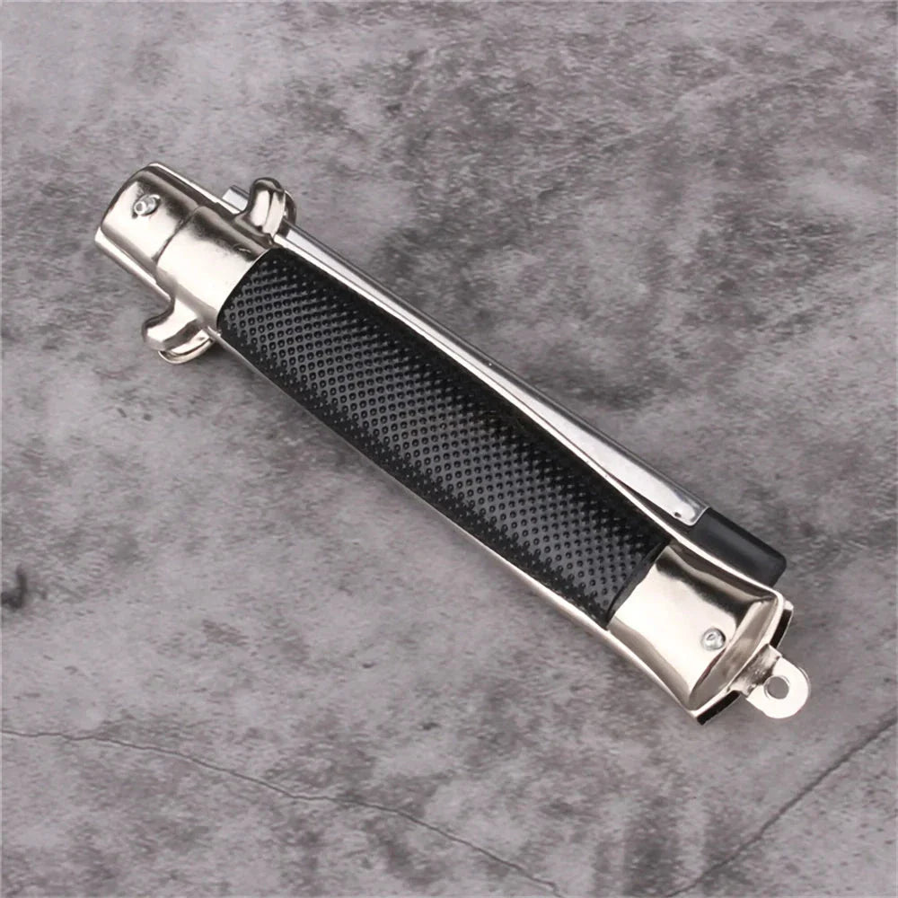 Butterfly Knife Style Folding Comb - A stylish and functional metal comb with a folding design inspired by the butterfly knife